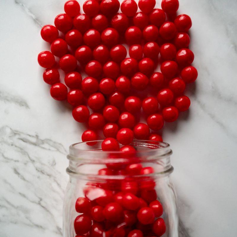 Cherry Sours 14oz. Feel the tangy kick with our Cherry Sours! These little balls of sour, cherry goodness will make your taste buds tingle with each bite. A fun, fruity treat for anyone who loves a little extra zing! $7.00 USD