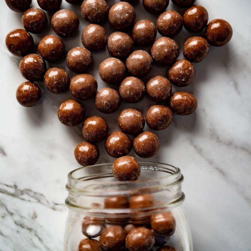 malted milk balls 14oz. One of our classic chocolate treats! These malt balls are double-coated in two layers of smooth, delicious milk chocolate. Once you start, you won’t be able to stop! $10.00 USD