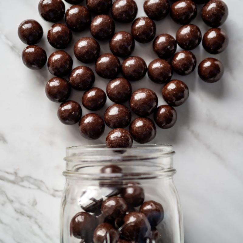 Dark Chocolate Malt Balls 14oz. Enjoy the perfect blend of crunchy malted milk centers coated in rich dark chocolate. These malt balls are sure to satisfy your sweet cravings! $11.00 USD
