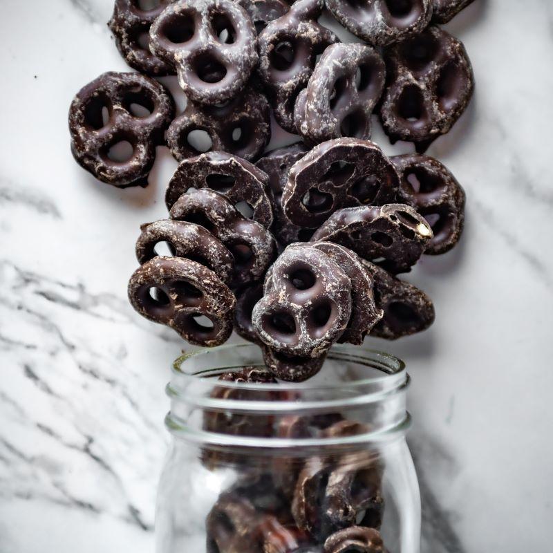 Dark Chocolate Pretzels 13oz. Get ready to experience the perfect balance of salty and sweet! These crispy bowtie pretzels are coated in rich, velvety dark chocolate for a flavor explosion in every bite. The ideal treat for dark chocolate lovers! $9.00 USD