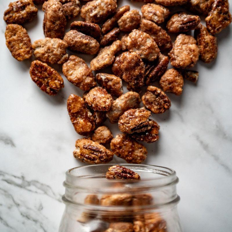 Toffee Toasted Pecans 12oz. Get ready for a sweet treat that’s impossible to resist! Our toffee toasted pecans are roasted to a golden perfection and glazed with a rich sugar-butter coating. These crunchy, caramelized delights are a decadent snack or perfect for adding a touch of sweetness to any dish! $12.00 USD