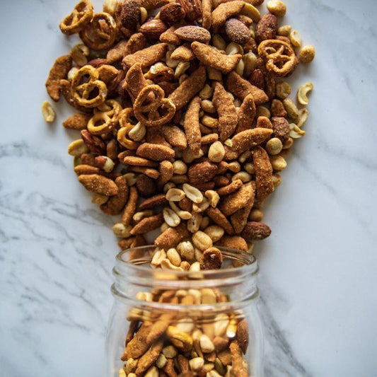 Baja Party Mix 14oz. Start a party in your mouth with this irresistible mix! Packed with cashew pieces, roasted Virginia peanuts, wasabi almonds, wasabi peanuts, roasted pumpkin seeds, zesty sesame sticks, and pretzel balls, it’s the ultimate blend to satisfy all your crunchy cravings. $8.00 USD