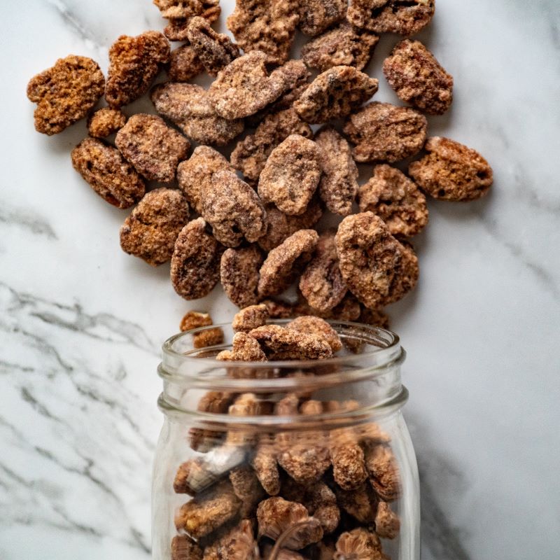 Cinnamon frosted pecans 10oz. Satisfy your sweet tooth with our Cinnamon Frosted Pecans! These crunchy pecans are coated in a perfect blend of cinnamon and sugar, creating a deliciously sweet and spicy flavor combo. $11.79 USD