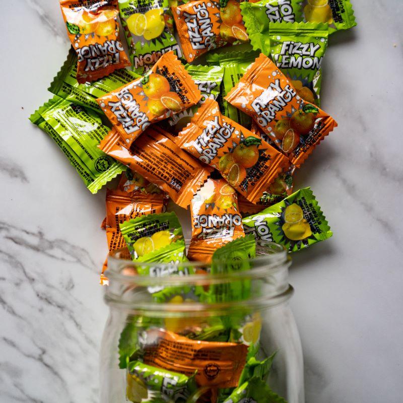 fizzy fruit candies 12.5oz. Get ready for a sweet and fizzy surprise with every bite! These heart-shaped candies are bursting with tangy lemon and orange fruit flavors, and each one has a fizzy center that makes your taste buds tingle. It’s a fun, fruity treat you won’t want to put down! $5.99 USD
