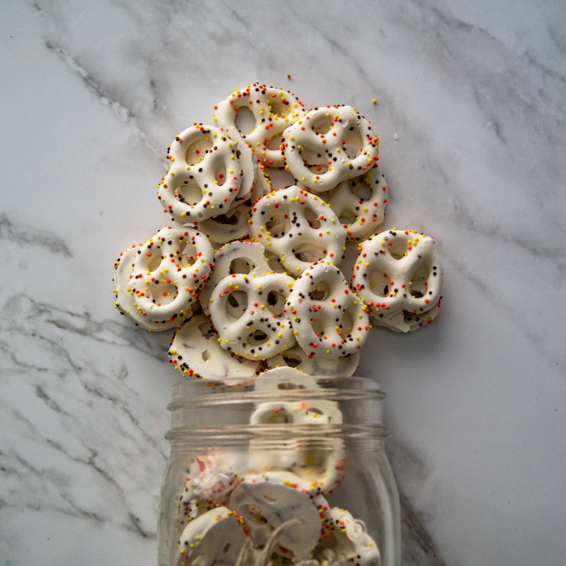 harvest sprinkled pretzels 13oz. Dive into the fall vibes with our delicious Harvest Sprinkled Pretzels! These crunchy pretzels are coated in creamy white confection and topped with festive, colorful sprinkles. Perfect for any fall celebration! $10.00 USD