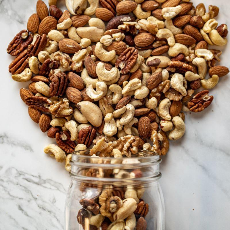 raw mixed nuts 14oz. This wholesome blend includes jumbo cashews, almonds, pecans, walnuts, filberts, and Brazil nuts, all packed with healthy fats, proteins, and essential nutrients. Perfect for fueling your day with a naturally delicious crunch. $10.00 USD