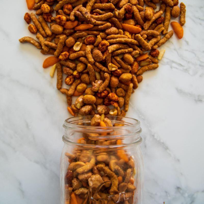 sweet explosion™ 14oz. Combines the perfect balance of sweet and spicy in every bite. Hot peanuts, chili crackers, honey roasted peanuts, toffee peanuts, slivered almonds, honey roasted sesame sticks, ragin’ Cajun sesame sticks, and cheddar sticks come together in this bold mix. $7.99 USD
